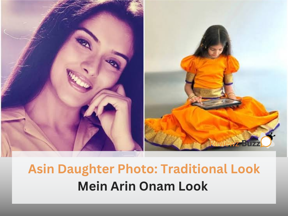 Asin Daughter Photo showing Arin Rayn in traditional orange South Indian attire making floral rangoli for Onam.